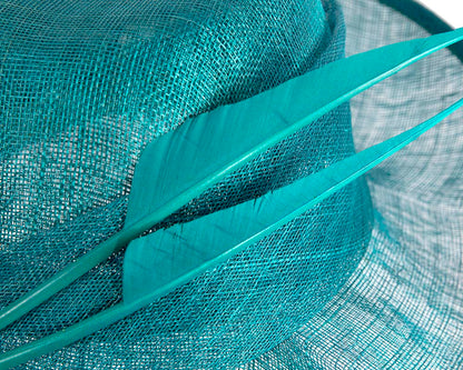 Elegant teal green hat with feathers